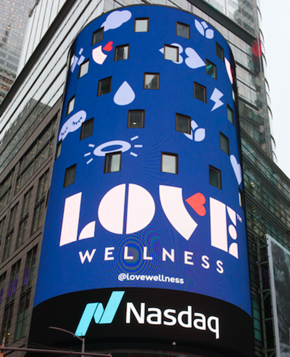 Love Wellness's rebrand on a billboard in TImes Square. 