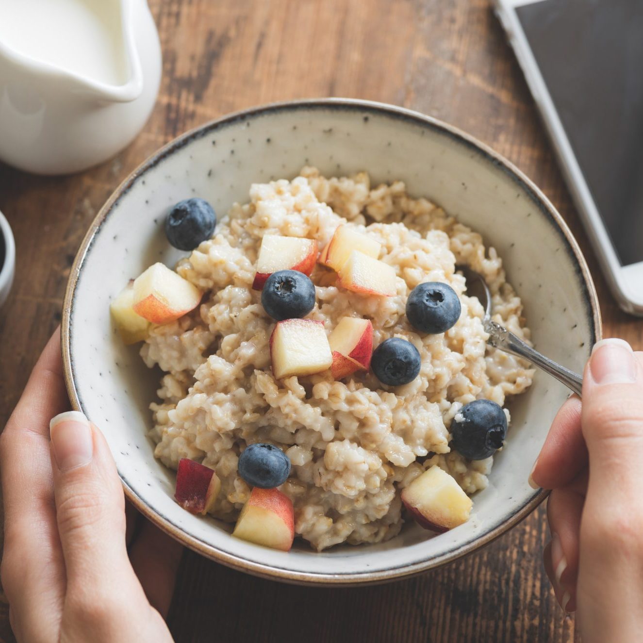 Eating healthy breakfast. Oatmeal porridge in bowl