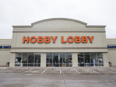 Signs are posted at the front entrance of Hobby Lobby on Preston Road in Dallas. Hobby Lobby, Michaels and Joann craft stores were ordered to be closed earlier this month by Dallas County Judge Clay Jenkins.