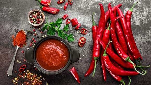 Eating extremely spicy foods may heat you up by stimulating the metabolism, and being too warm makes it hard to sleep.