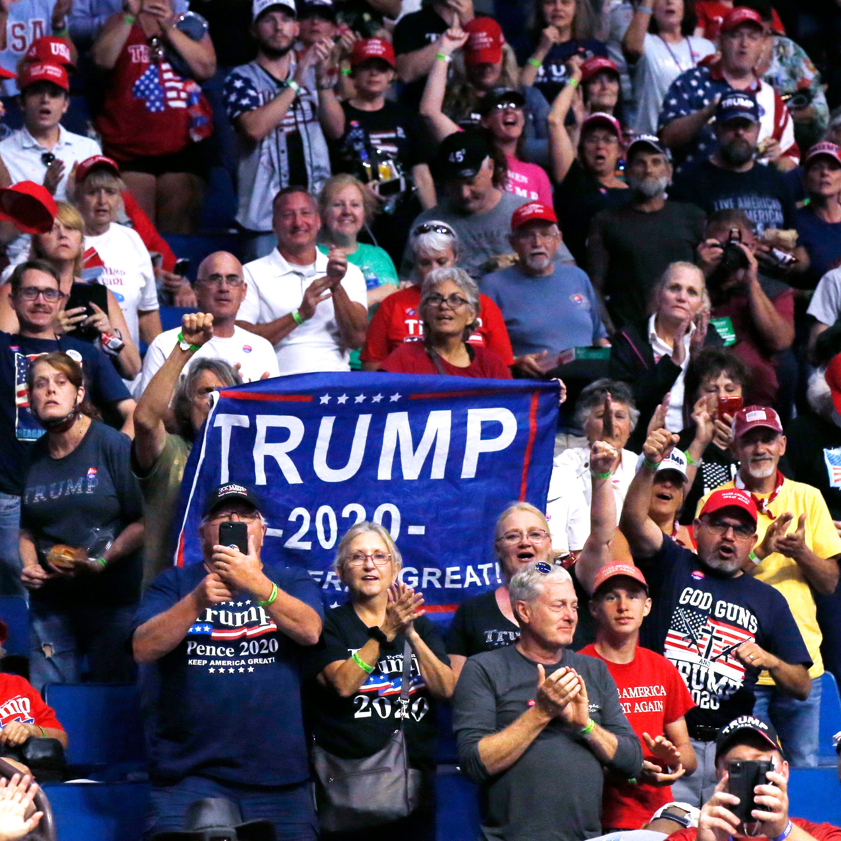 President Donald Trump supporters cheer Eric Trump, the son of President Donald Trump, not pictured, before a Trump campaign rallym Saturday in Tulsa, Okla.