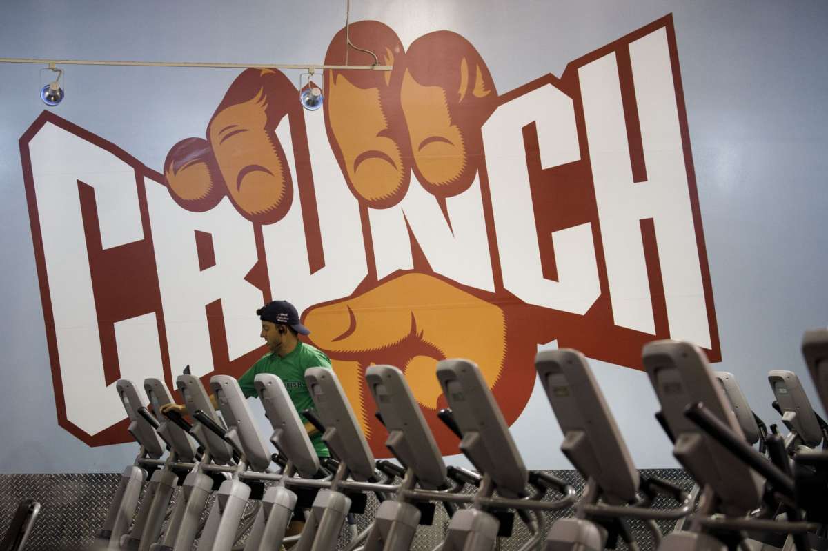 A person exercises on an elliptical machine at a Crunch Fitness gym location in Burbank, California, U.S., on Tuesday, June 23, 2020. California's new cases rose by a record and Florida infections jumped more than the weekly average, more signs of a possible resurgence of coronavirus in U.S. Sun Belt states. Photographer: Patrick T. Fallon/Bloomberg