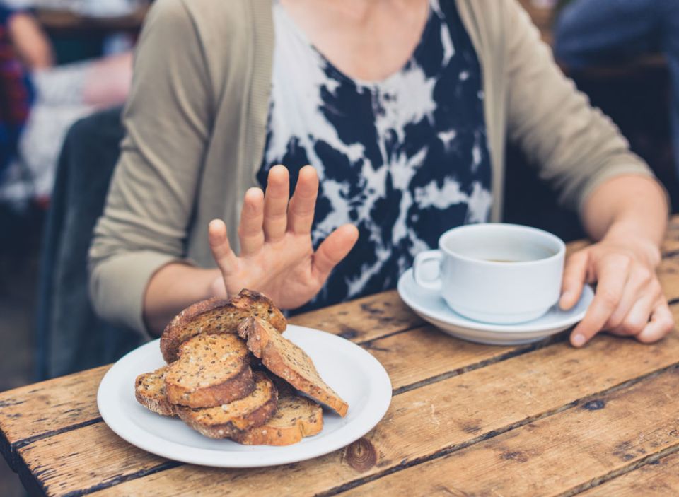 Woman refusing to eat bread